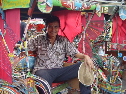 Becak driver at rest, Bandung