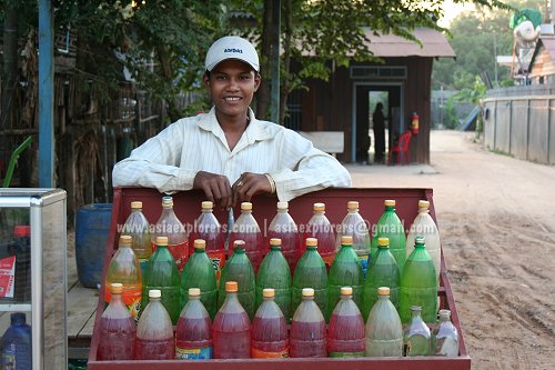Boy selling fuel by the roadside