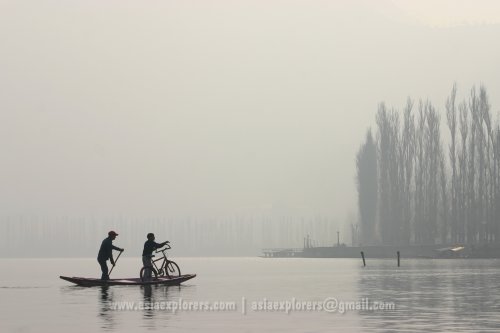 Two boys crossing Dal Lake