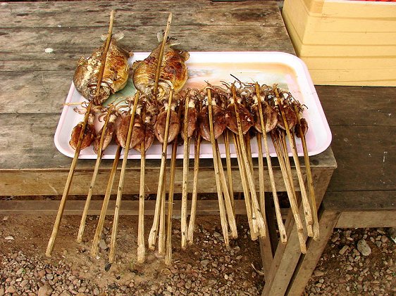 Grilled fish and squid on sale at the market in Kep, Cambodia