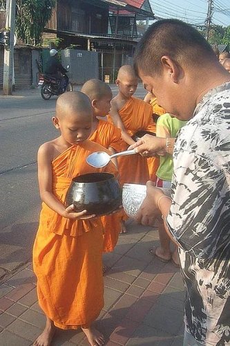 Novice monks with alms bowl