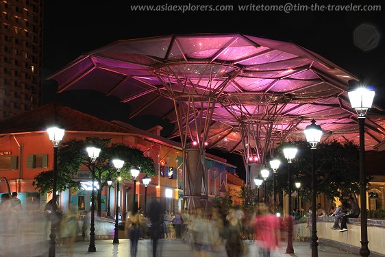 Pedestrians crossing Read Bridge at Clarke Quay
